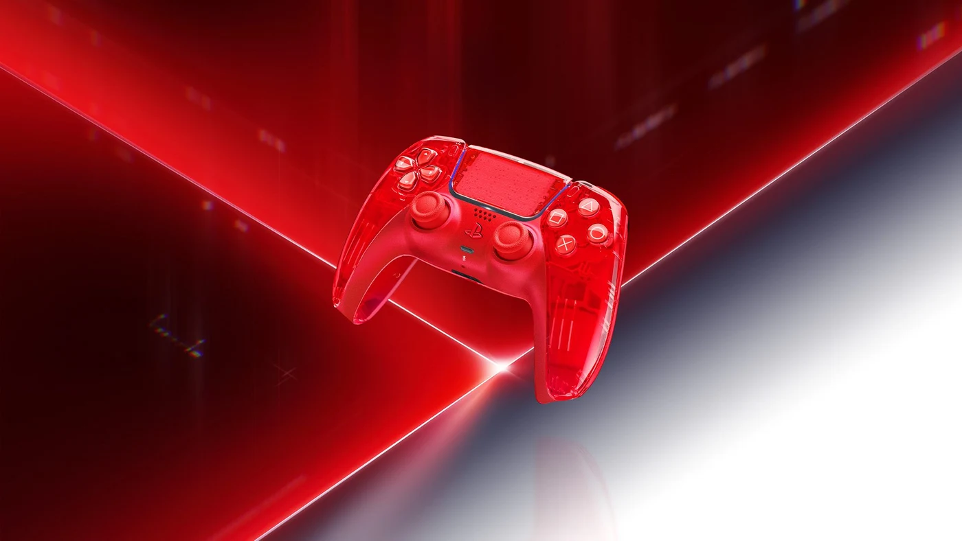 Transparent orange DualSense controller on a red illuminated background.