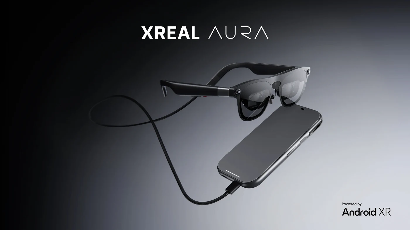 Official XREAL Aura product image showing the glasses, connecting cable and compute puck.